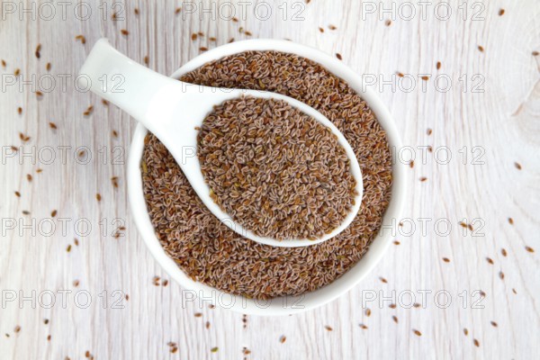 Top view of psyllium seeds in a white porcelain bowl