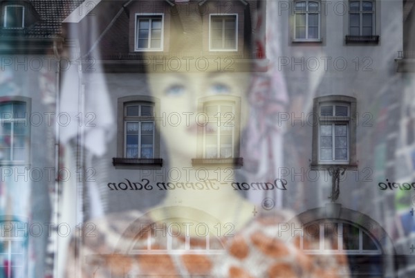 Reflection in a windowpane, women's fashion, Bad Karlshafen, Weser Uplands, Weserbergland, Hesse,