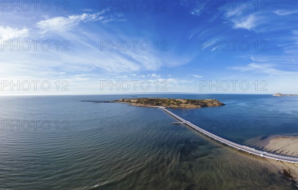 An aerial view of the famous Granite Island Recreation Park and causeway in Victor Harbor on a