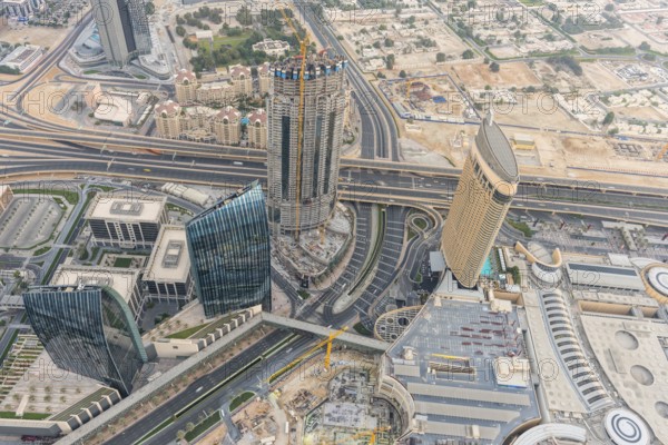 DUBAI, UAE - JANUARY 02, 2015: Dubai downtown sunrise morning scene. Top view from above