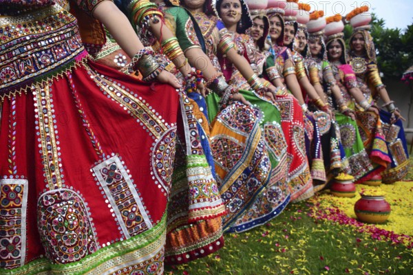 Girls in traditional attire, practice the Garba dance steps in preparation for the Navratri
