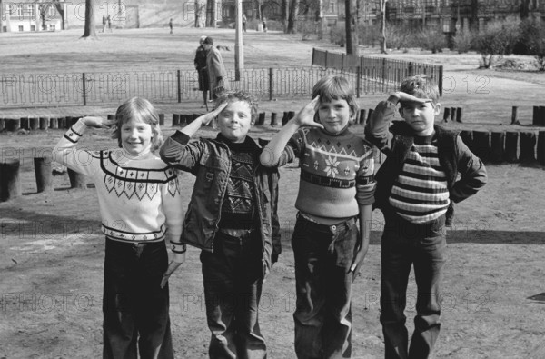 09/09/1978 GDR East Berlin district of Prenzlauer Berg. Three boys and a girl on a playground at