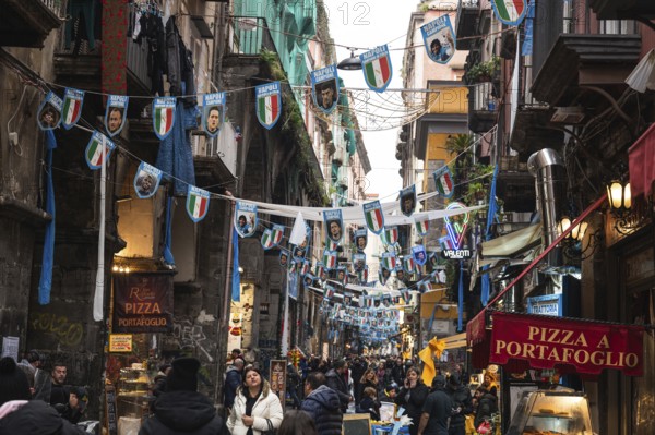 NAPLES, ITALY - JANUARY 14, 2024: A street with the pennants of the football team FC Napoli, the