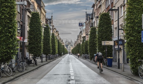 Leuven, Flanders, Belgium, 06 16 2019 Man on a bike driving down the Bondgenotenlaan at the