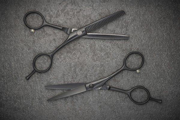 Barber Professional Tools. Haircut Fashion. Pair Of Professional Haircutting Scissors On Black