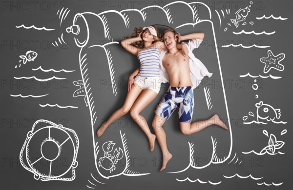 Happy valentines love story concept of a romantic couple lying on an air mattress, sharing