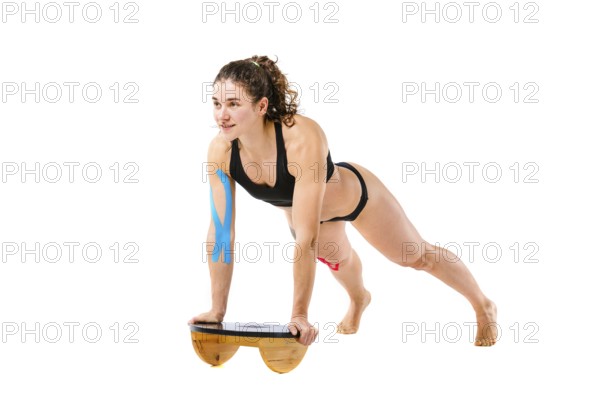 Kinesio tape girl, exercise push ups. Attractive Young sport Woman Doing Push Up Exercise in full
