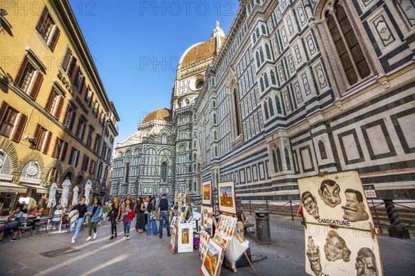 Florence Tuscany Italy on September 30, 2019 Artists exhibit paintings in front of the Duomo in