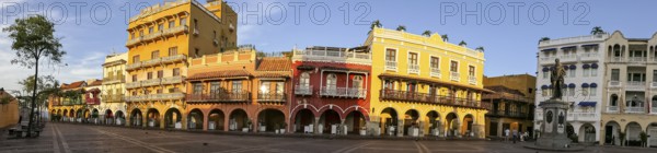 Panorama of an ensemble of colorful historic buildings on a sunny day in Cartagena, Colombia,