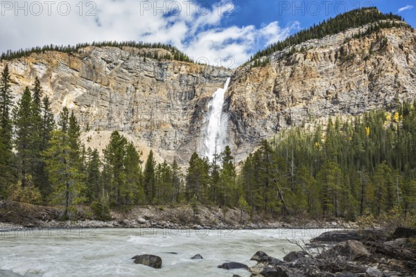 Sunny autumn day in Yoho National Park in the Rocky Mountains of Canada. Colossal Takakkaw