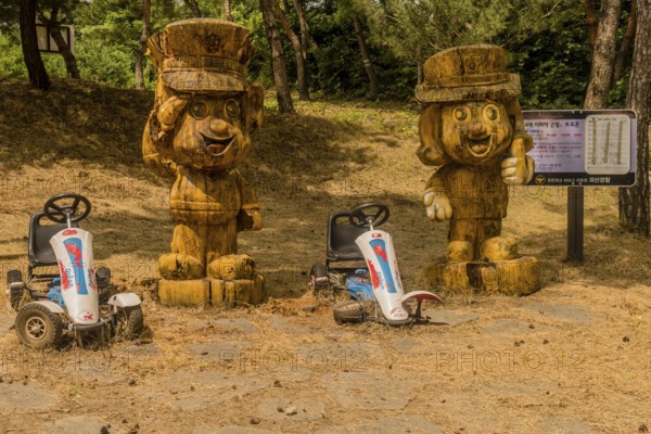 Geosan, South Korea, August 26, 2020: Carved wood statues of Korean police officers in mountain