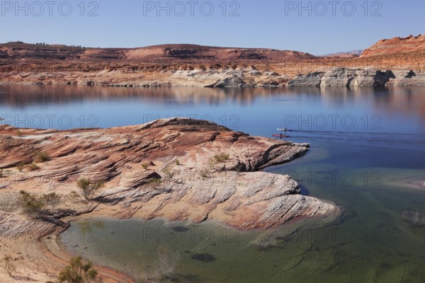 Antelope Canyon in the Navajo Reservation. Two boats with oars float near the water channel