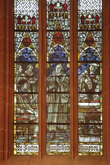 Colourful church window with Martin Luther by Otto Linnemann 1918 with Luther quote from 1521,