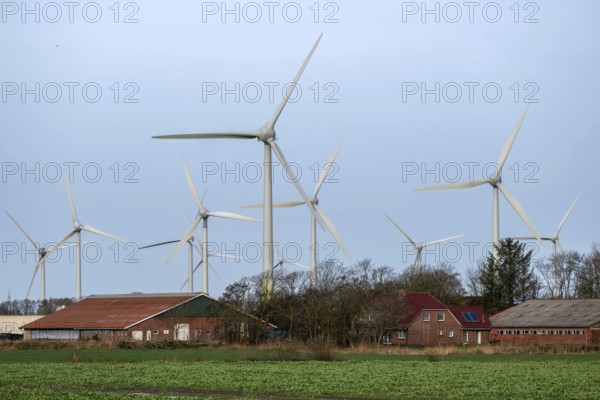 Norden, Lower Saxony, Germany - Wind turbines, wind farm near Norden in East Frisia. In front a
