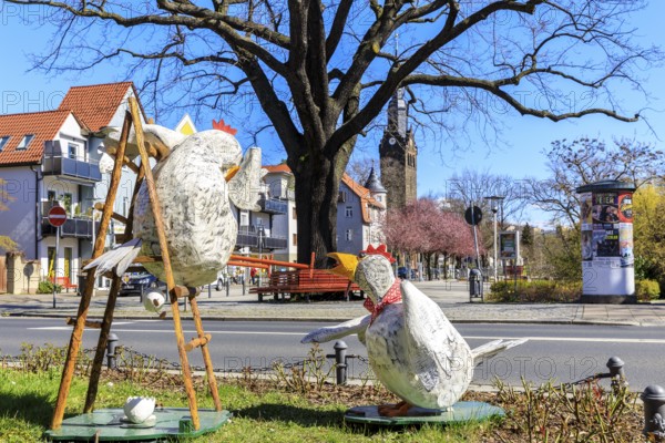 Funny Easter decoration with chickens at Wettinplatz, in the background the New Church Peter and