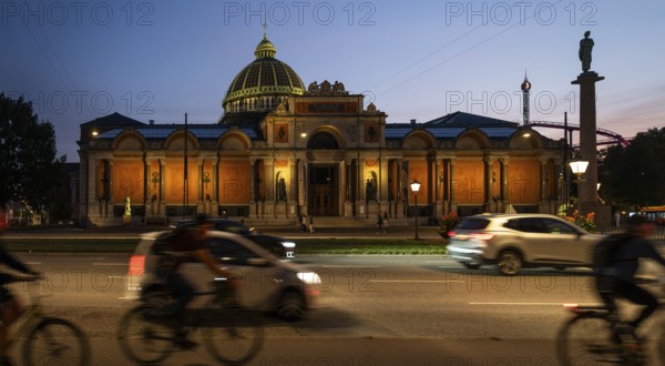 Cyclist, illuminated Ny Carlsberg Glyptotek or New Carlsberg Glyptotek in the evening, Art Museum