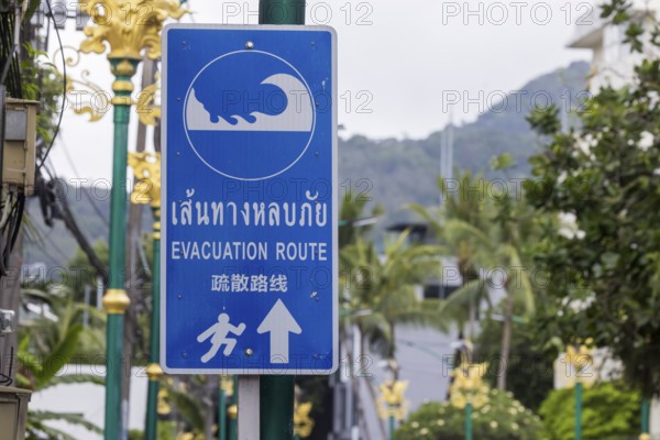Tsunami Hazard Zone. Warning sign, signposting of escape routes in the event of another seaquake.