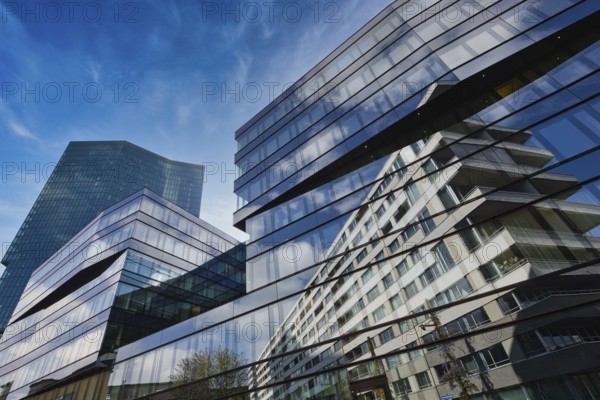 Modern glass building with impressive reflection of the blue sky in the city, Prime Tower, Zurich,