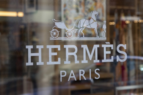 Close-up, logo of the French luxury fashion brand Hermes on a boutique in the shopping street Neuer