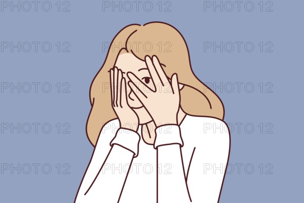 Woman covers eyes with hands and peeps, refusing to see unpleasant things and hiding from problems.