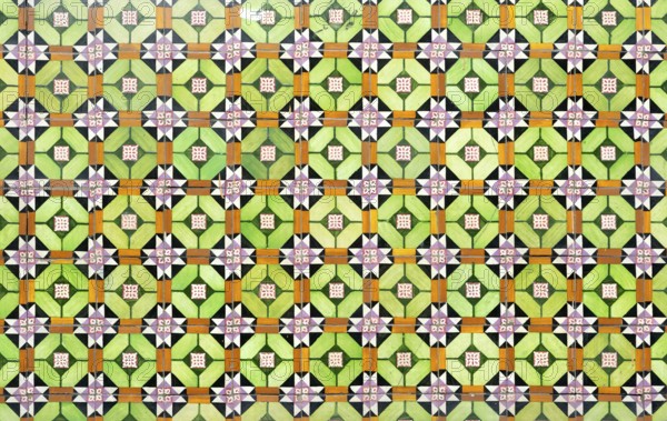 Bright colourful pattern of ceramic tiles on wall of house, Rua das Trinas, Guimaraes, northern