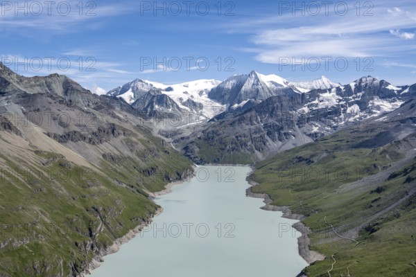 Blue mountain lake in a mountain landscape with glaciers, Lac des Dix reservoir and Mont Blanc de