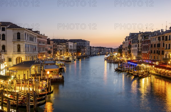View of the Grand Canal at the blue hour, picturesque evening mood with illuminated palazzos on the