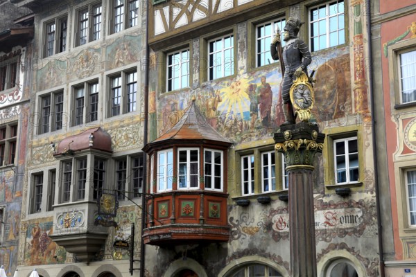 Soldier figure on the market fountain, house facade with facade painting in the old town, Stein am