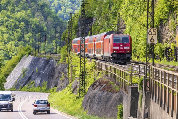 Regional express RE5 en route on the winding railway line of the Geislinger Steige. Landscape along