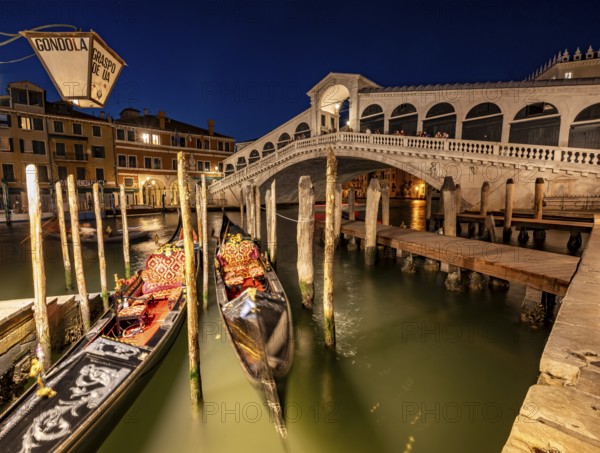 Rialto Bridge and gondolas on the Grand Canal, blue hour, long exposure, Venice, Veneto, Italy,