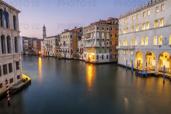 View of the Grand Canal at sunset, picturesque evening mood with illuminated palazzos on the canal