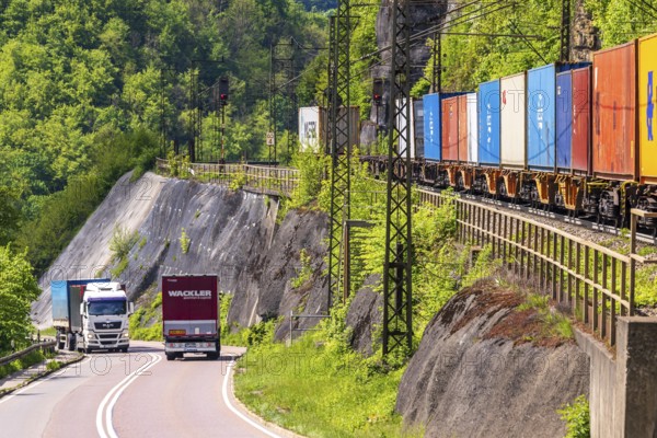 Goods train travelling on the winding Geislinger Steige railway line. Landscape along the railway