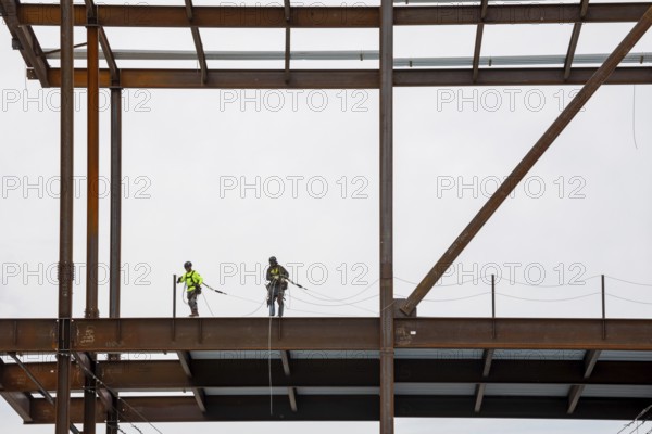 Detroit, Michigan - Workers string safety lines as structural steel rises on a $2.2 billion