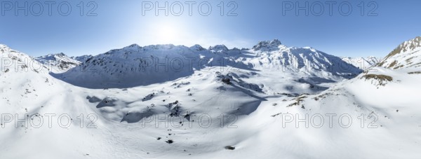 Alpine panorama, aerial view in winter, Alpine Club hut Kesch-Hütte in front of mountain peak Piz