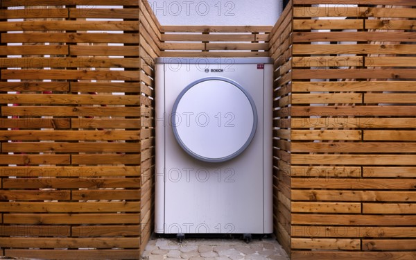 Bosch Compress 7400i AW air-to-water heat pump, logo, outdoor unit, building services, standing in