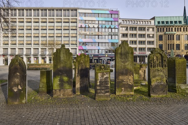 Historic gravestones, general architecture, diffuse light, pale blue cloudy sky, slightly sunny,