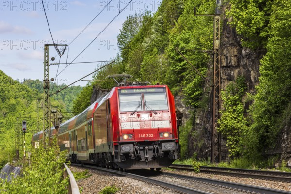 Regional express RE5 en route on the winding railway line of the Geislinger Steige. Landscape along
