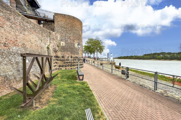 View of historic town wall and former customs tower for customs duties on the Rhine promenade of