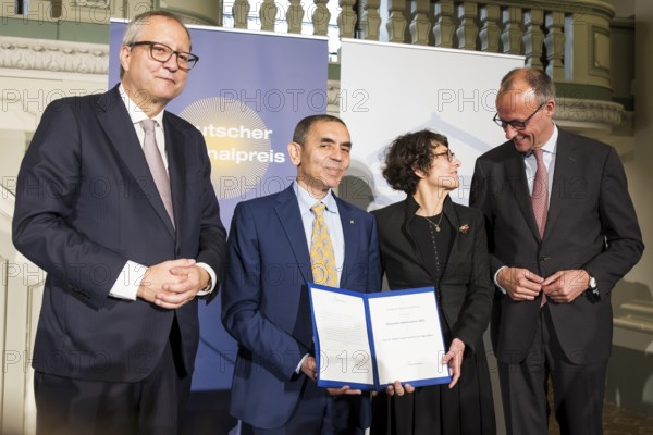 Thomas Mirow (Chairman of the Board of the German National Foundation), Ugur Sahin and Özlem Türeci