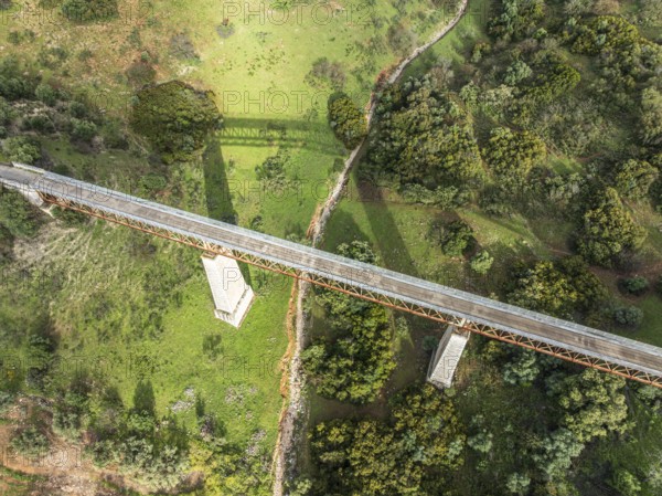 Cycle path Via Verde Del Aceite, old railroad track passes through olive fields, cycle path on