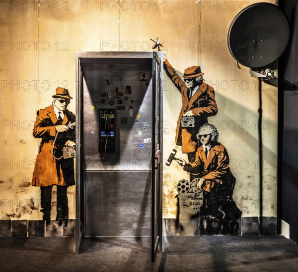 Banksy - Spy Booth, reference to state surveillance, 2014, Cheltenham, UK, exhibition The World of