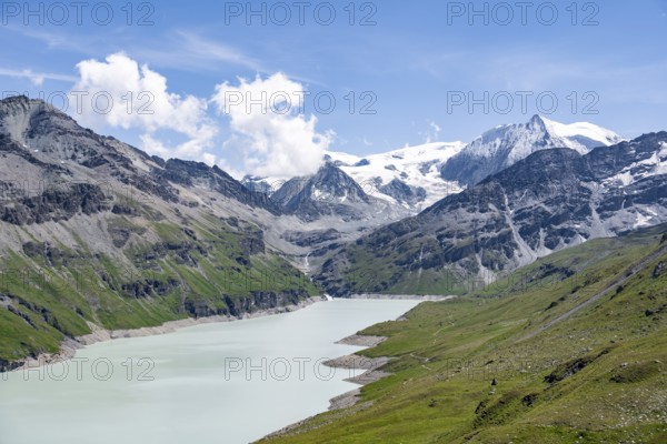 Blue mountain lake in a mountain landscape with glaciers, Lac des Dix reservoir and Mont Blanc de