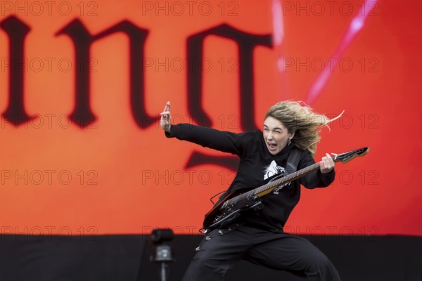 Daniela Villarreal Vélez, singer of The Warning is surprised by a gust of wind at the Rock am Ring