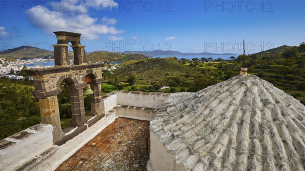 View from the roof with a view of the bell tower and landscape towards the blue sea, Monastery of