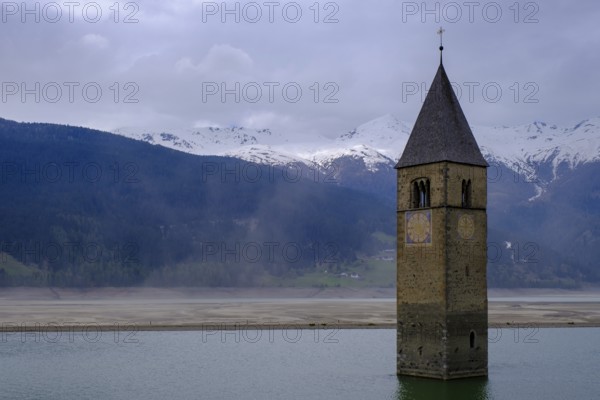 Bad weather at the church tower of Altgraun in Reschensee, Reschenpass, Vinschgau, South Tyrol,