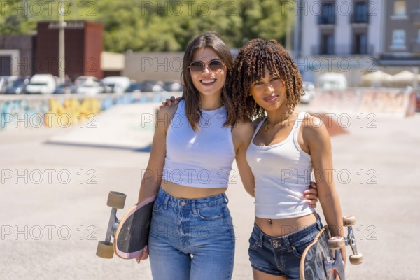 Two young women smiling and holding skateboards, enjoying their time together in a vibrant