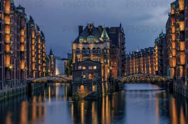 View of the Speicherstadt at night in Hamburg, Germany. Illuminated Speicherstadt seen from the
