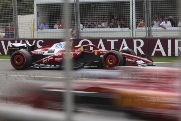 MELBOURNE, AUSTRALIA - MARCH 15: Lewis Hamilton of Great Britain spins the Scuderia Ferrari HP