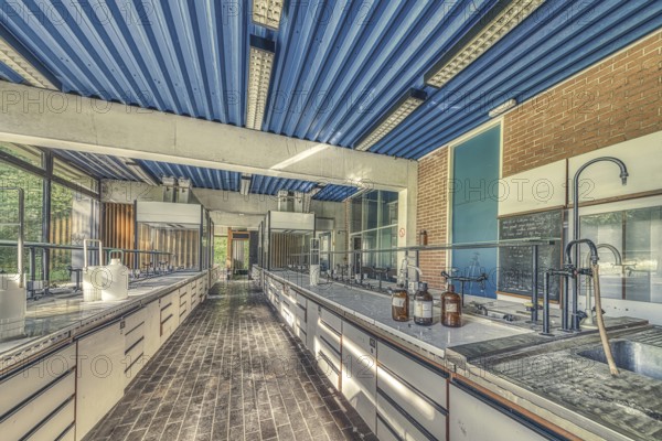 An abandoned laboratory room with long benches and glass containers under daylight, Institute of