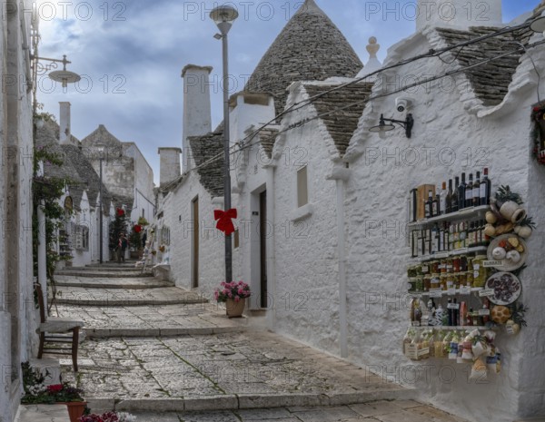 Alberobello, Italy, 2 December, 2023: souvenir shop woth local specialities in the Rione Monti